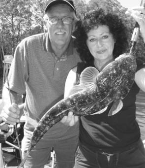 Pam and Grahame Fothergill with a solid South Coast dusky flathead. At around 70cm it's a nice way to open your account. The fish was released.